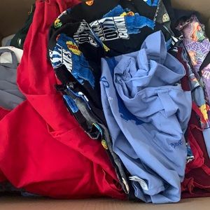 Box full of scrubs. Tops and bottoms